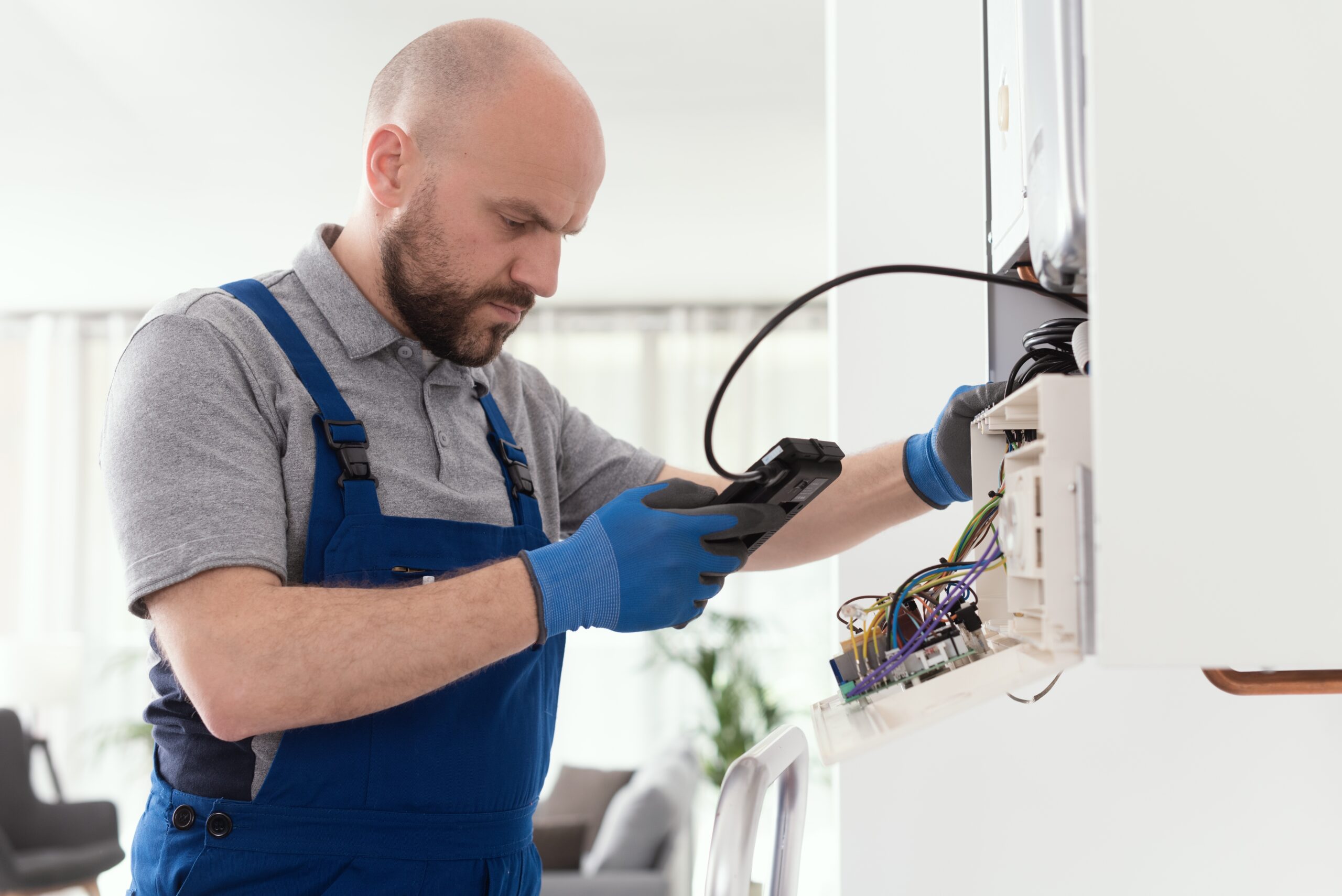 Qualified engineer checking flue gas emissions on a domestic gas boiler
